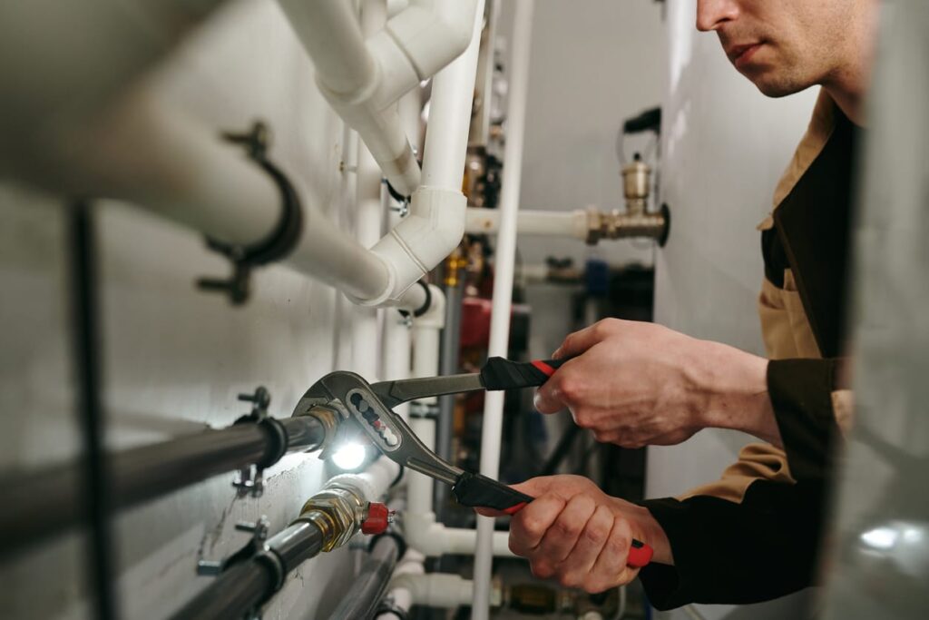 Plumbers maintaining commercial plumbing pipes in Bethlehem